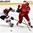 GRAND FORKS, NORTH DAKOTA - APRIL 22: Latvia's Pauls Svars #12 and Denmark's Nikolaj Krag #11 battle for the puck during relegation round action at the 2016 IIHF Ice Hockey U18 World Championship. (Photo by Matt Zambonin/HHOF-IIHF Images)
